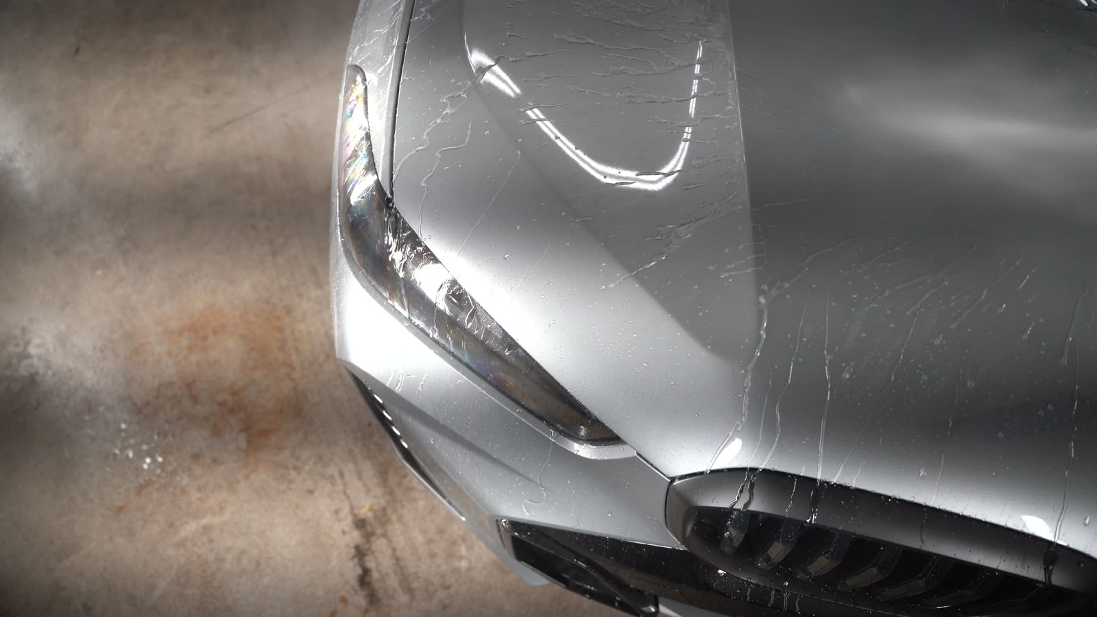Water beading and running off a freshly coated hood