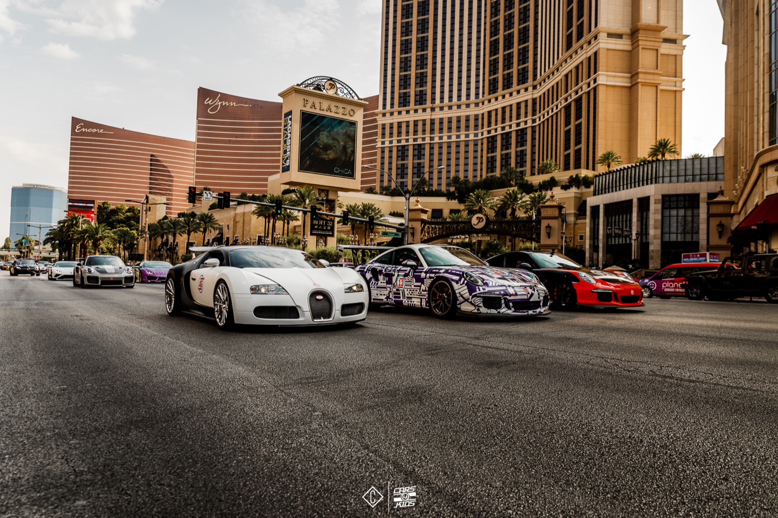 The Cars 4 Kids drive rolling past the Las Vegas strip