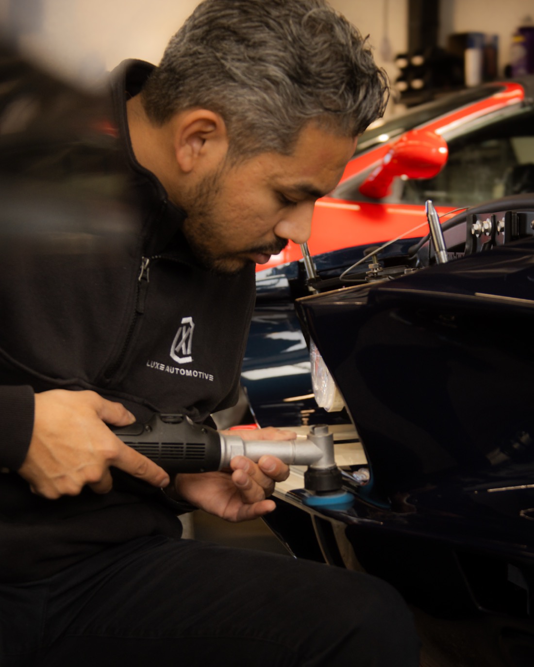 Close polishing work on a classic fender