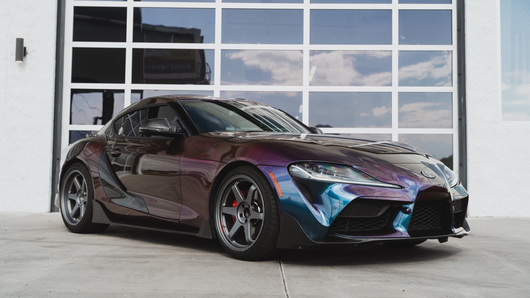 Toyota GR Supra · Color shift wrap, chrome delete