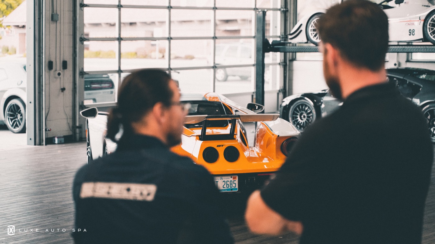 A LUXE advisor walking a client through the work on their car
