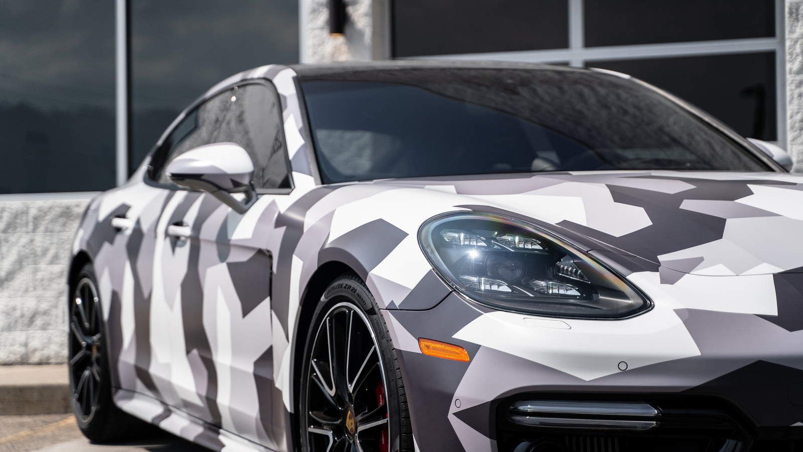 Porsche Panamera · Printed camo wrap, chrome delete